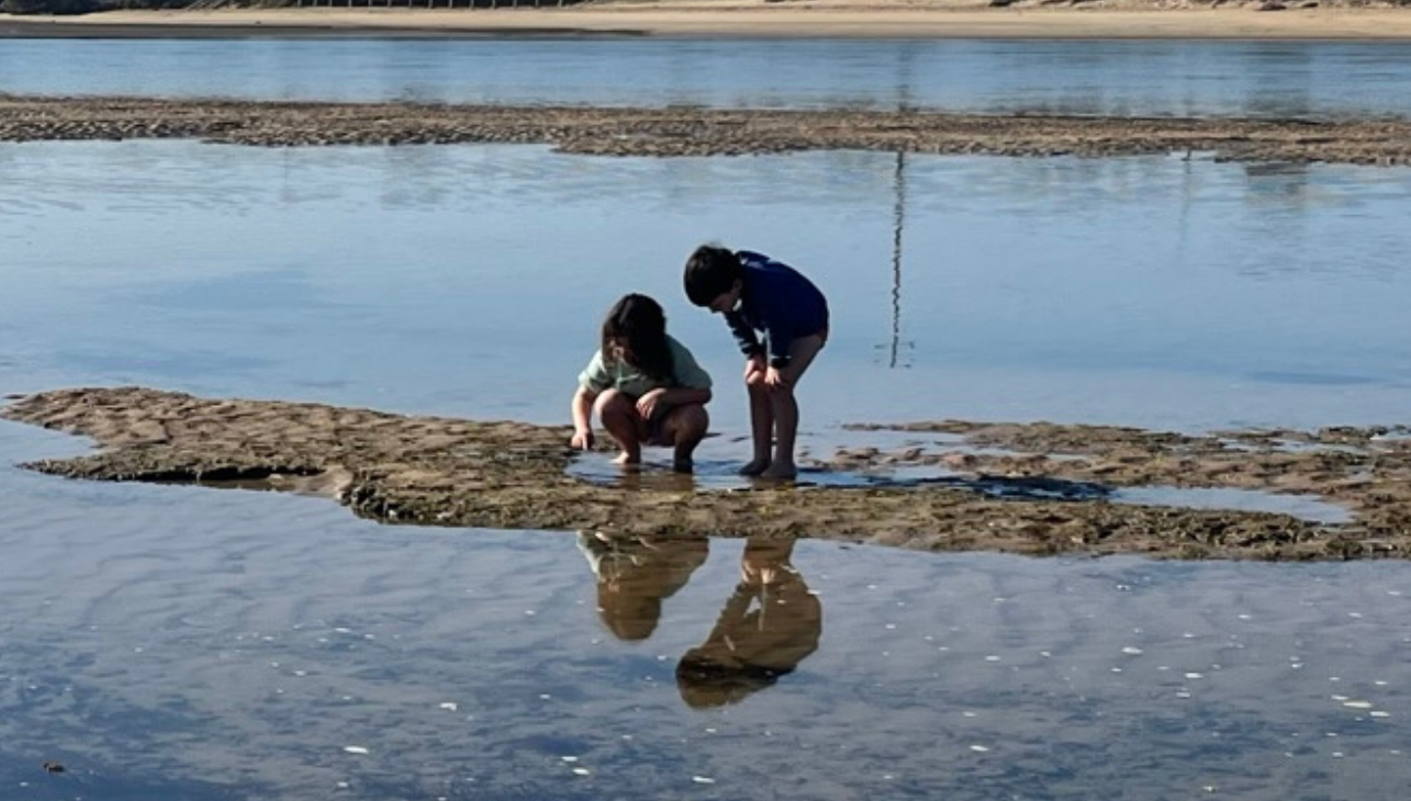 Two small children explore the Barwon River