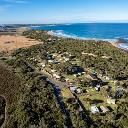 Aerial image of Breamlea Caravan Park shows the wetland, caravan park, dunes and beaches